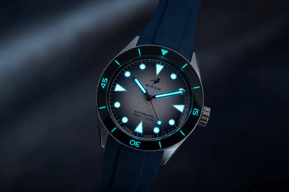 Wren Diver One Snow in the dark with hands, markers and the full bezel scale glowing